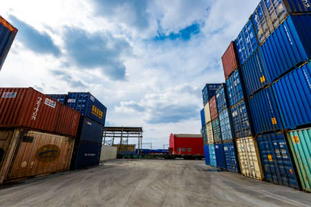 Summer, 2016 - Primorsky Krai, Russia - Container terminal. Metal containers stand in straight rows in an open storage warehouseのeditorial素材