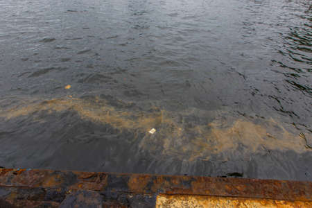Ecological catastrophy. Close-up. Spill of oil products into the sea. Poisonous oil products float...
