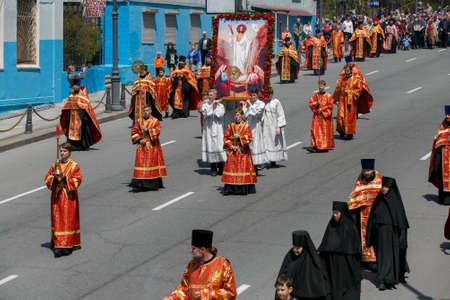Spring, 2016 - Vladivostok, Russia - Orthodox Easter religious procession in Vladivostok. Cossacks with crosses in their hands stand against the background of an Orthodox church.のeditorial素材
