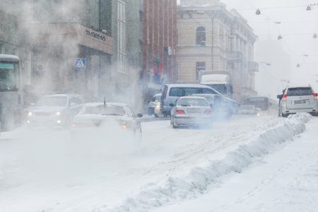 January, 2016 - Vladivostok, Russia - Heavy snowfall in Vladivostok. Cars drive during snowfall along the central streets of Vladivostok.のeditorial素材