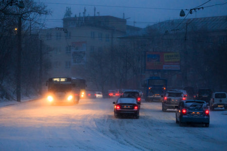 January, 2016 - Vladivostok, Russia - Heavy snowfall in Vladivostok. Snow-covered cars stand along the roadside during heavy snowのeditorial素材
