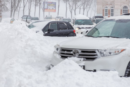 January, 2016 - Vladivostok, Russia - Heavy snowfall in Vladivostok. People walk along the central streets of Vladivostok covered with snow. Pedestrians walk past large snowdrifts through the cityのeditorial素材