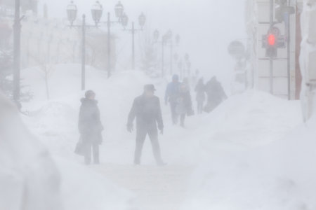 January, 2016 - Vladivostok, Russia - Heavy snowfall in Vladivostok. Lonely man walks past the...