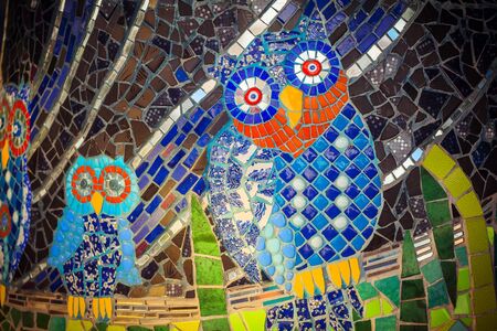 Painted stone owl on a palette. Owl pattern mosaicの写真素材