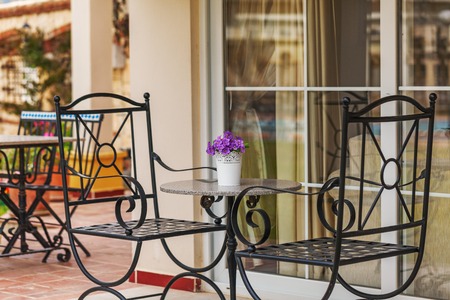 Forged elegant chairs on the veranda of a Villa in the classical styleの写真素材