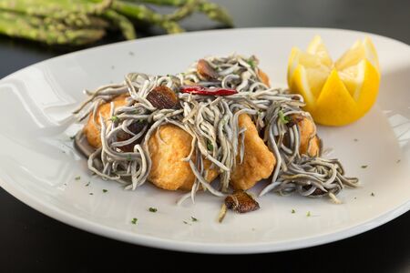 Delicious baby eels with fried cod, typical Basque foodの写真素材