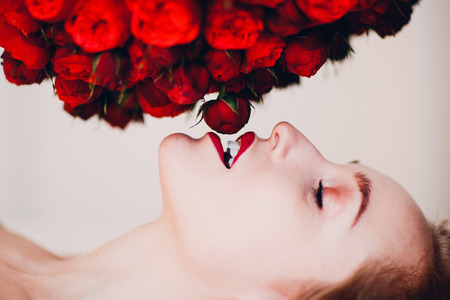 Pretty young female and flowersの写真素材
