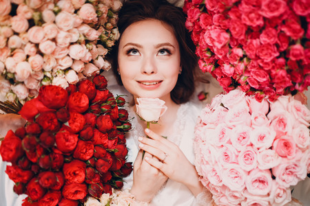 Dreaming young female and flowers. Aromatherapyの写真素材