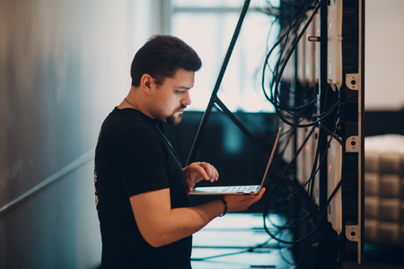 Freelancer admninistrator works on laptopの写真素材