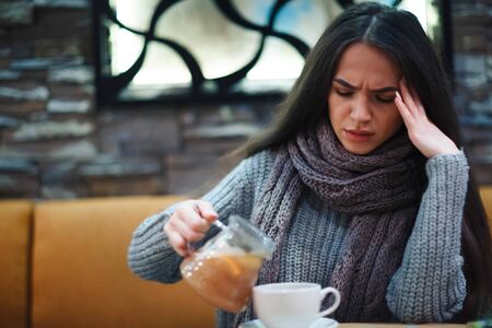 Flu cold or allergy symptom.Sick young woman having common cold.の写真素材