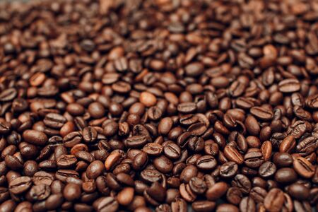 Roasted coffee beans brown seeds texture background wallpaper.の写真素材