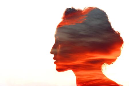 Woman with clouds in her headの写真素材