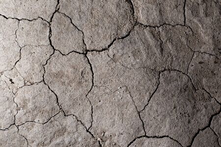 Dry cracked earth ground texture. No watering desert.の写真素材
