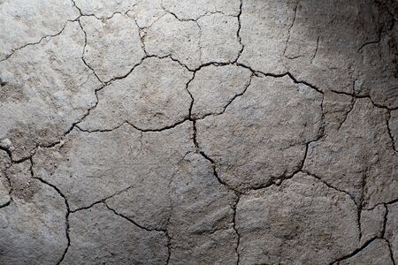 Dry cracked earth ground texture. No watering desert.の写真素材