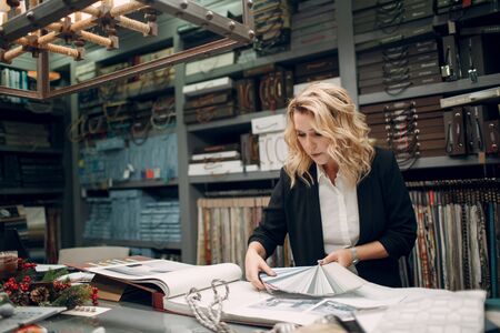 Interior designer woman at work. Design and interior decoration.の写真素材