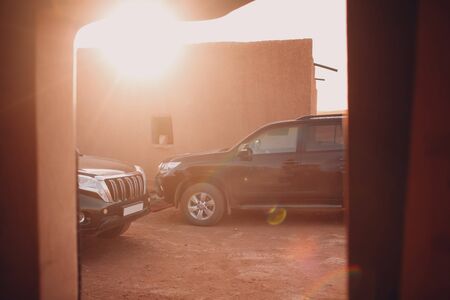 SUV in the desert oazis at building. Sahara, Moroccoの写真素材