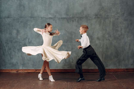 Young dancers boy and girl dancing in ballroom dance Sambaの写真素材
