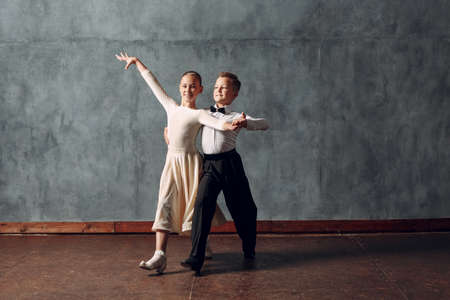 Young couple boy and girl dancing in ballroom dance Viennese Waltzの写真素材