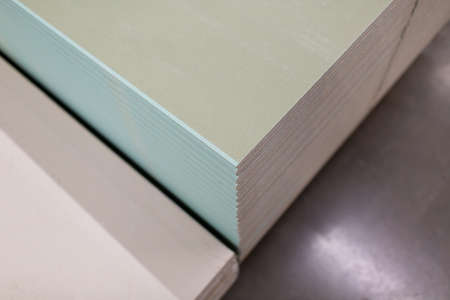 Pallet with Drywall sheets plasterboard in the building warehouse storeの写真素材