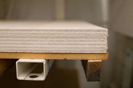 Pallet with Drywall sheets plasterboard in the building warehouse storeの写真素材