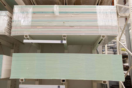 Pallet with Drywall sheets plasterboard in the building warehouse storeの写真素材
