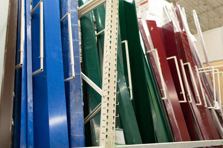 Siding metal multi-colored pallet row set rack ready for construction on hardware industrial store.の写真素材