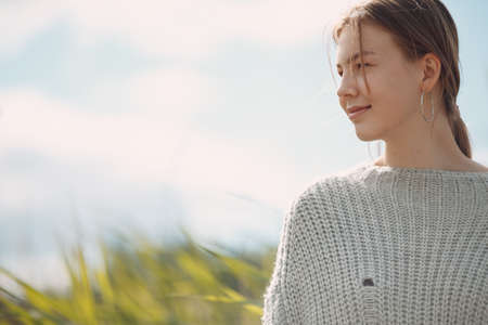 Pretty smile young woman portrait outdoor in the park at summer.の写真素材