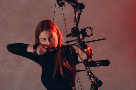 Archer woman with sport bow and arrowの写真素材