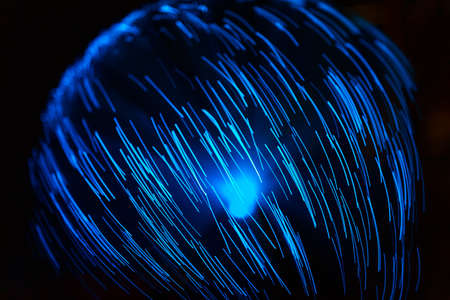 Blue abstract particles and lines with bokeh and blur in dark backgroundの写真素材