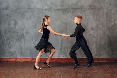 Young couple boy and girl dancing in ballroom dance Jiveの写真素材