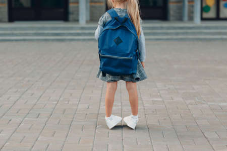 Cute little girl with backpack going back to schoolの写真素材