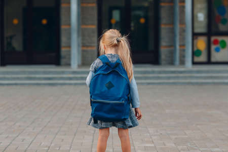 Cute little girl with backpack going back to schoolの写真素材