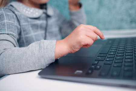 Young student little girl with laptop learning and preparing back to schoolの写真素材