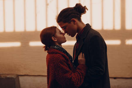 Silhouette of loving young couple standing face to face at Valentines day datingの写真素材