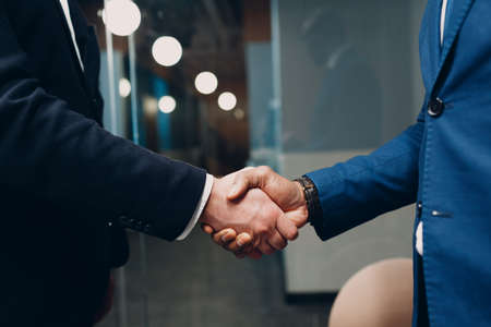 Businessman handshake success deal team at office meeting. Business people group conference...