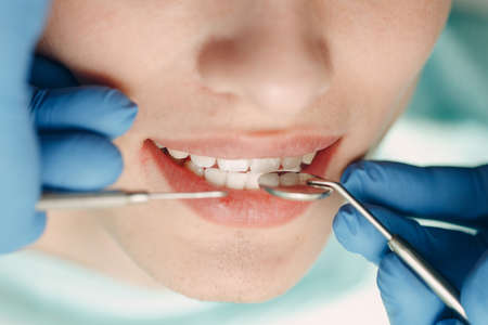 Dentistry. Dentist and patient. Dental clinic. Close up teeth.