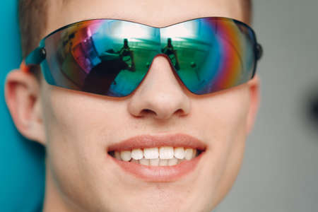 Dentistry. Dentist and patient. Dental clinic. Close up teeth. Protect glasses goggles.