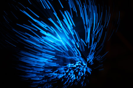 Blue abstract particles and lines with bokeh and blur in dark background.の写真素材