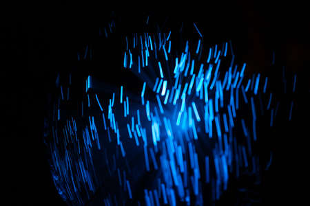 Blue abstract particles and lines with bokeh and blur in dark background.の写真素材