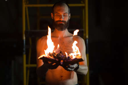 Man hold burning book in his handsの写真素材
