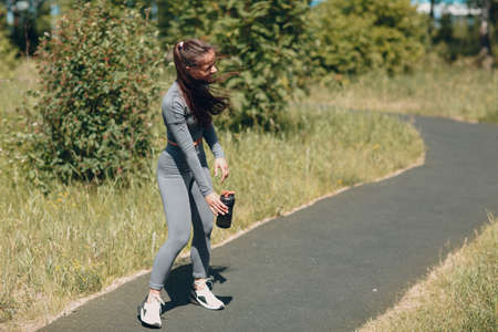 Relaxing tired woman after running jogging funの写真素材