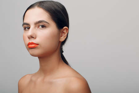 Portrait of young beautiful positive woman with nude make upの写真素材