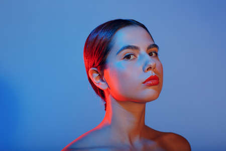 Portrait of young beautiful positive woman with nude make upの写真素材