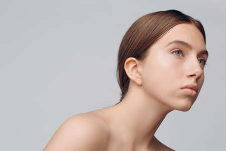 Portrait of young beautiful positive woman with nude make upの写真素材
