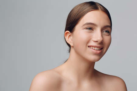 Portrait of young beautiful positive woman with nude make upの写真素材