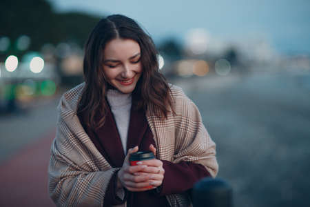 Young beautiful woman with coffee drink cupの写真素材