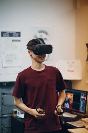 Young man in virtual reality goggles, vr glasses headset