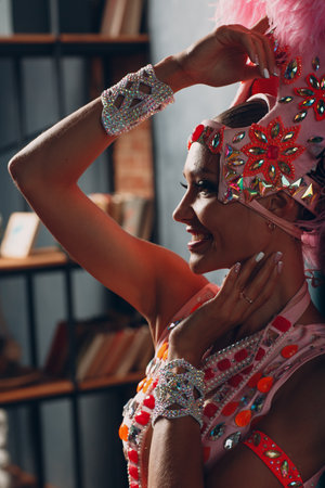 Woman in samba or lambada costume with pink feathers plumage.の写真素材