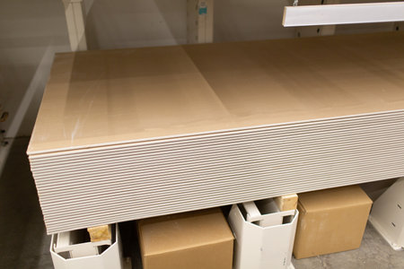 Pallet with Drywall sheets plasterboard in the building warehouse storeの写真素材