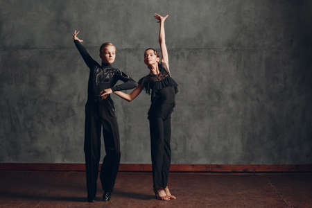 Young couple dancing in ballroom dance Paso doble.の写真素材